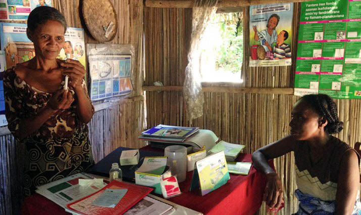 A community health volunteer in Madagascar demonstrates how to provide Depo-Provera.
